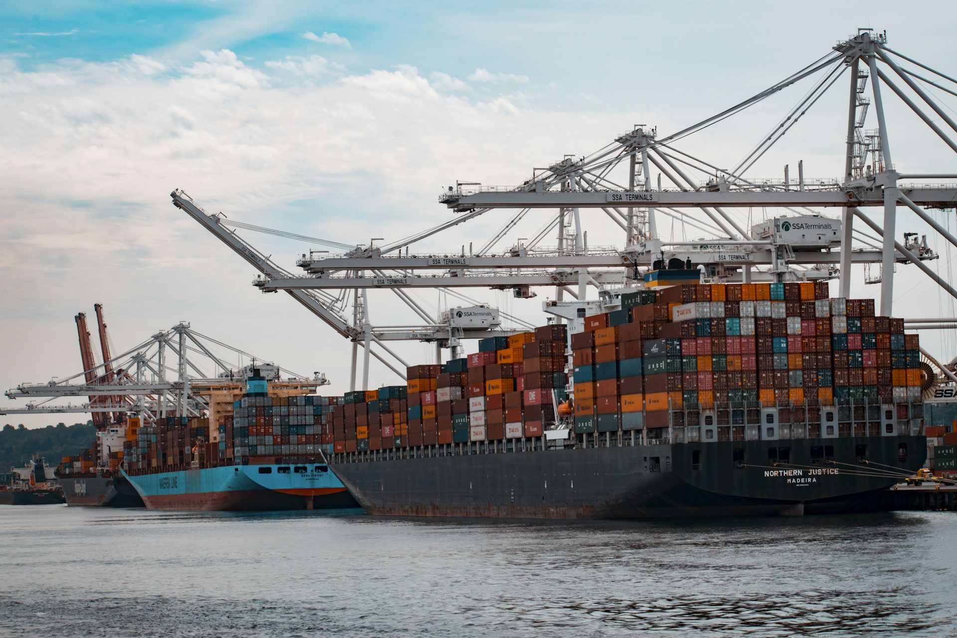 Container ship at a port with cranes